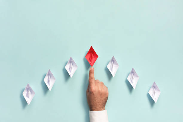 istock Leadership Concept with Businessman and Paper Ship 1179781334