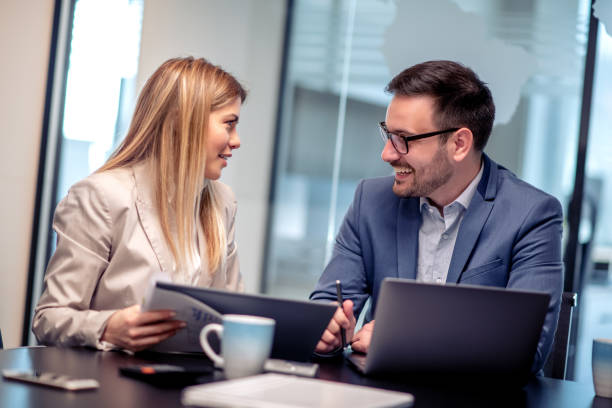 istock Two business colleagues working together on new project 1179781440