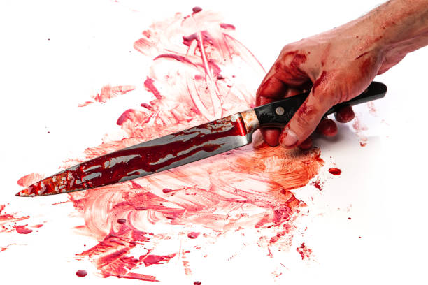 istock Male hand with bloody knife 1179783466