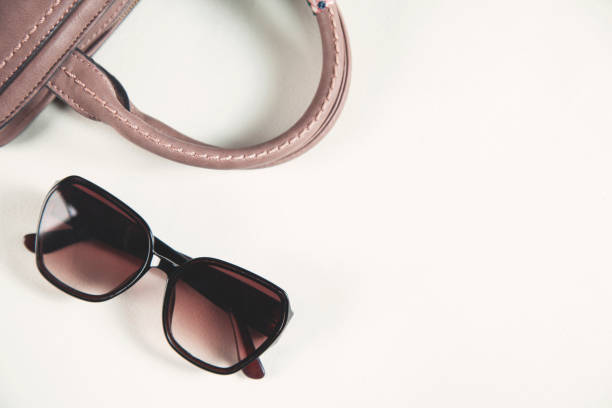 istock woman bag with sunglasses 1179786107