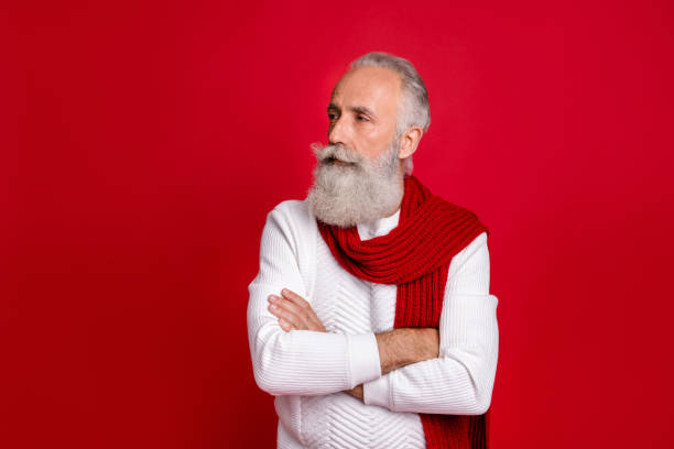 istock Profile side photo of attractive person looking crossing his hands wearing white pullover isolated over red background 1179786394