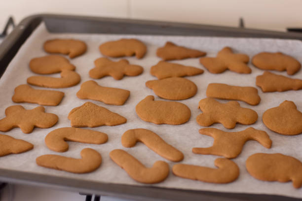 istock Fresh baked homemade Chritstmas gingerbread cookie on a baking tray. Selective focus 1179786698