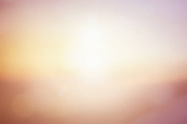 istock Natural background blurring warm colors and bright sun light. Bokeh or Christmas background Green Energy at sky sunny color orange light patterns plain abstract flare evening clouds blur. 1179786965