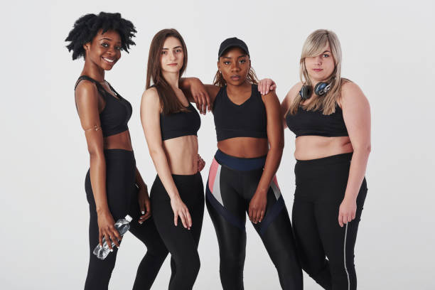 istock Group of multi ethnic women standing in the studio against white background 1179788418