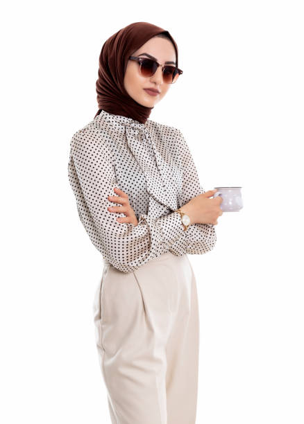 Beautiful muslim female holding coffee cup Beautiful muslim female holding coffee cup arabian sunglasses stock pictures, royalty-free photos & images