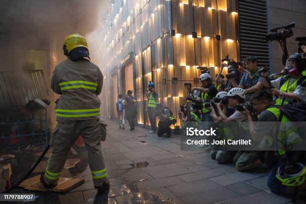 Photojournalists And Fireman At Work In Hong Kong Stock Photo - Download Image Now - Protest, Journalism, Journalist