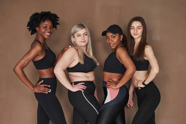 istock Don't blink please. Group of multi ethnic women standing in the studio against brown background 1179789029