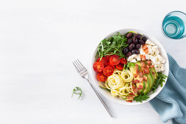 istock ketogenic lunch bowl: spiralized courgette with avocado, tomato, feta cheese, olives, bacon 1179789231