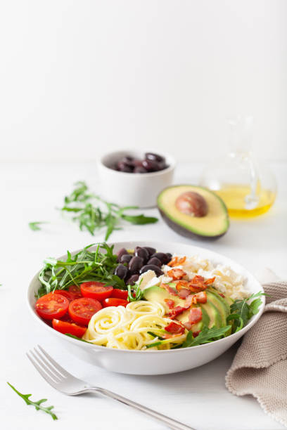 istock ketogenic lunch bowl: spiralized courgette with avocado, tomato, feta cheese, olives, bacon 1179789270
