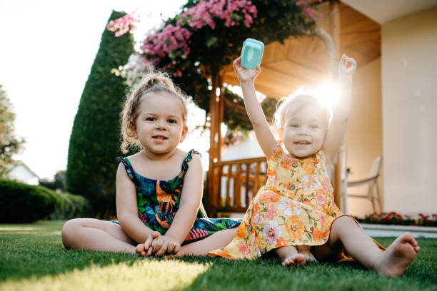 Happy Smiling Little Girl Lying On Grass