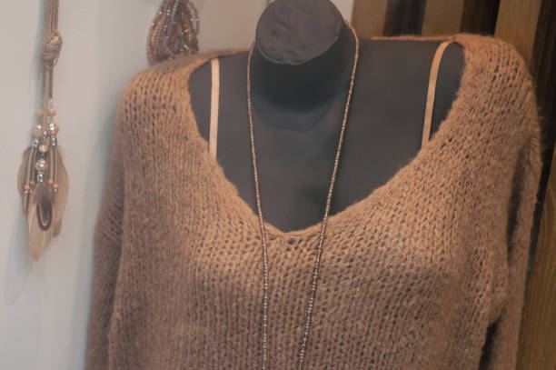istock brown woolen pullover on mannequin in fashion store showroom 1179790035