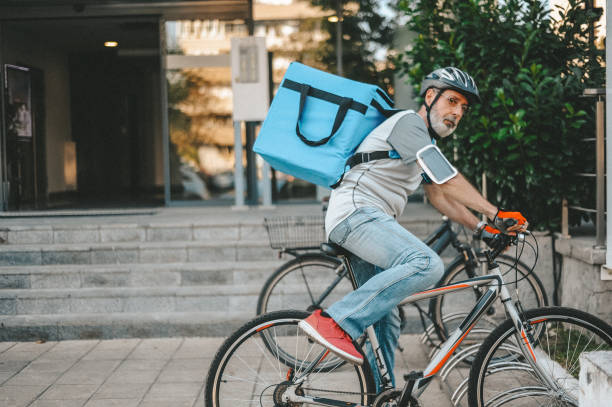 istock Active senior man doing food and package delivery as a side job 1179790116