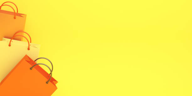 istock Empty orange color shopping bag on the yellow background, copy space text, Design creative concept for halloween day or autumn sale event 1179791682