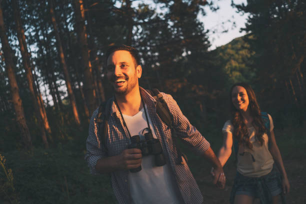 istock Happy couple is hiking in forest. 1179792267