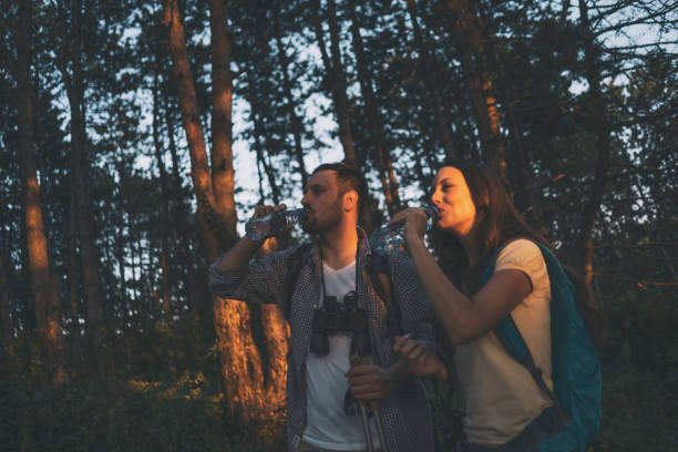 istock Couple is hiking in forest. 1179792271