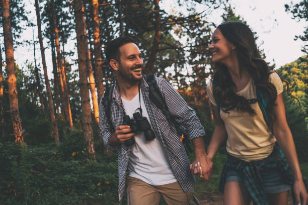 istock Happy couple is hiking in forest. 1179792316
