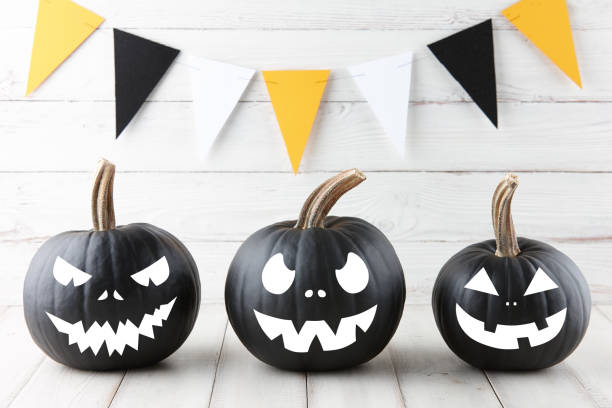 istock Halloween black pumpkins with scary faces 1179794960
