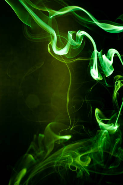 istock Green smoke motion on black background. 1179796180