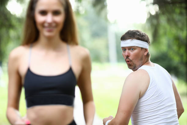 istock Obese man doing morning jogging in park 1179797234