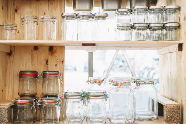 Old glass bottles and flasks on four shelves in the apothecary of the monastery of Santo Domingo de Silos, Burgos, Castilla y León, Spain.