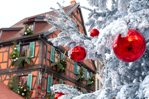 Traditional Christmas decorations on the facades and windows of houses. Alsace Colmar.