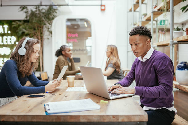 istock African millennial man working with multi-ethnic group of colleagues 1179798976