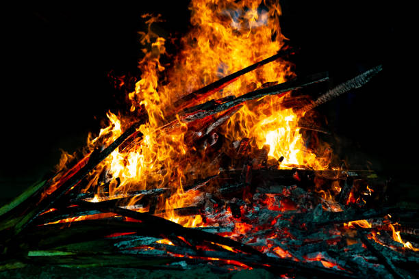 istock Bonfire that burns on a dark background, wood burning flame. 1179799070