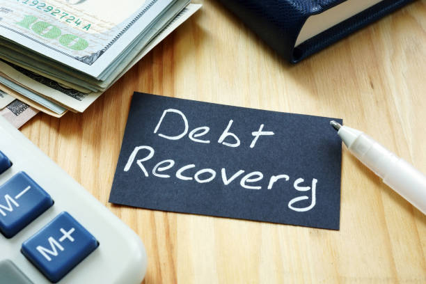 istock Text sign showing hand written words Debt recovery 1179800107
