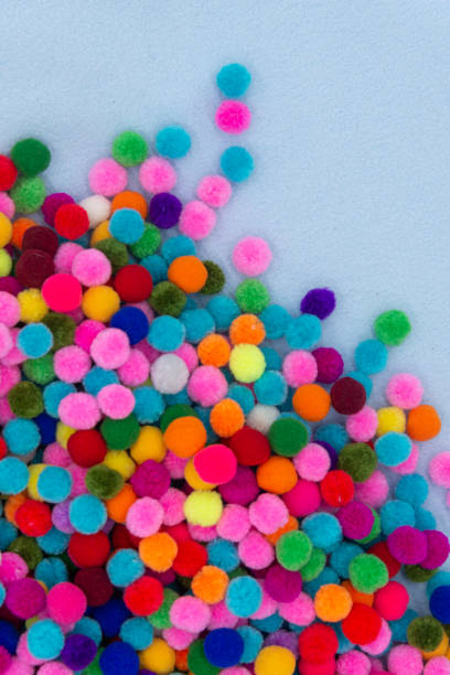 istock A colorful  Pom Pom background with white space 1179800189