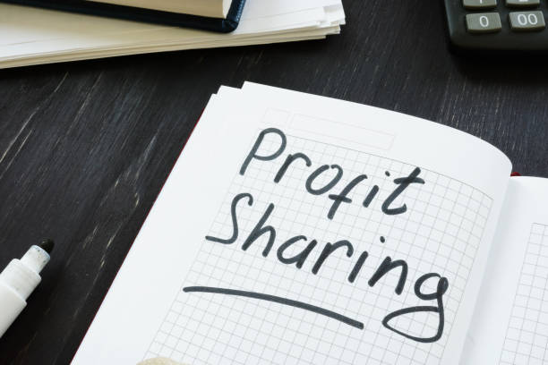 istock Text sign showing hand written words Profit sharing 1179800354