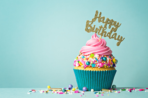 Celebration cupcake with happy birthday message