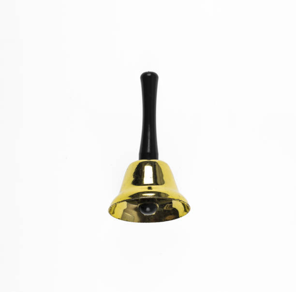 istock Old school hand bell,hotel yellow bell isolated on white background 1179801642