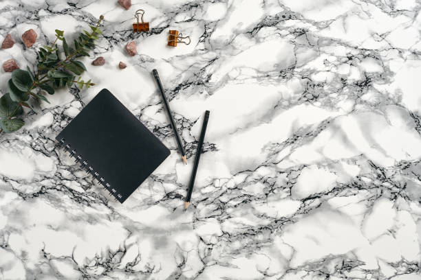istock Top view in focus with different office equipment, supplies, stationery. Marble table with copy space. Education, workplace background. Close-up 1179802022