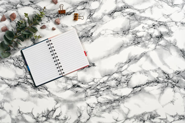 istock Top view in focus with different office equipment, supplies, stationery. Marble table with copy space. Education, workplace background. Close-up 1179802123