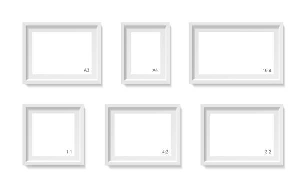 Empty picture frames mockup. Photo container template. 3d illustration isolated on white wall. Blank space for paper poster. Vector objects set Empty picture frames mockup. Different sizes, formats set (a4, a3, 1:1, 3:2, 4:3 and 16:9) Photo container template. 3d illustration isolated on white wall. Blank space for paper poster. Vector object mat photos stock illustrations