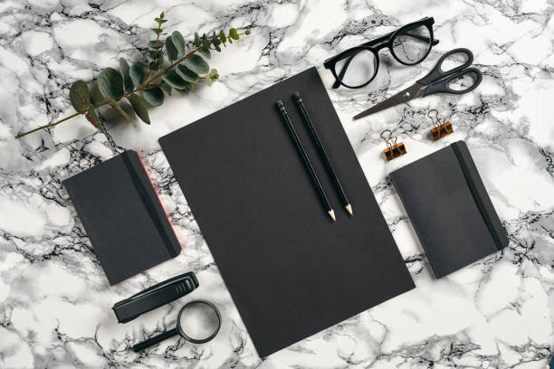 istock Top view in focus with different office equipment, supplies, stationery. Marble table with copy space. Education, workplace background. Close-up 1179803638