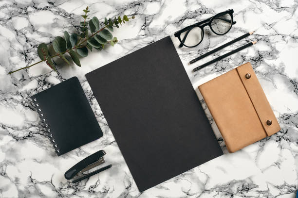 istock Top view in focus with different office equipment, supplies, stationery. Marble table with copy space. Education, workplace background. Close-up 1179804610