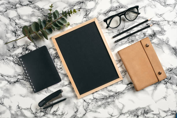 istock Top view in focus with different office equipment, supplies, stationery. Marble table with copy space. Education, workplace background. Close-up 1179804701