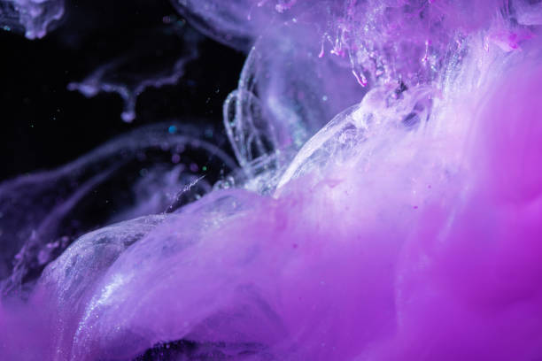 istock Pink ink in the water isolated on black background 1179804947