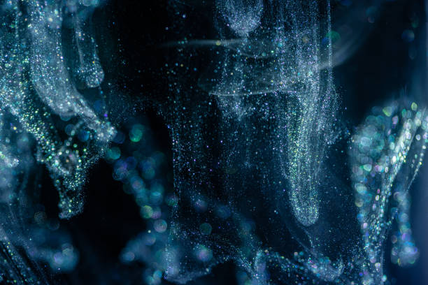 istock Acrylic ink with glitter floating in the water 1179805268