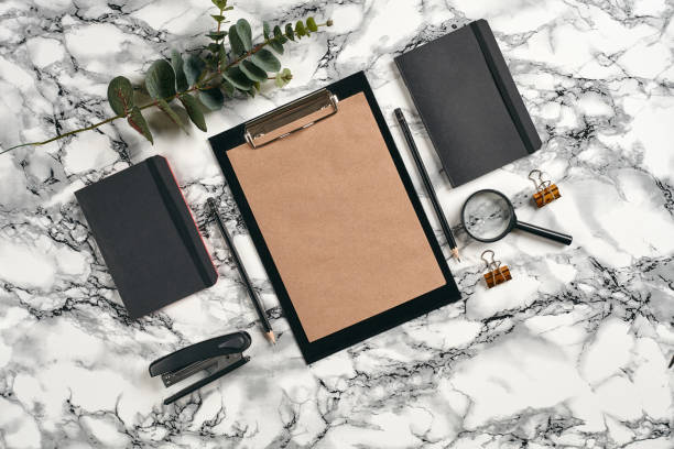 istock Top view in focus with different office equipment, supplies, stationery. Marble table with copy space. Education, workplace background. Close-up 1179805487