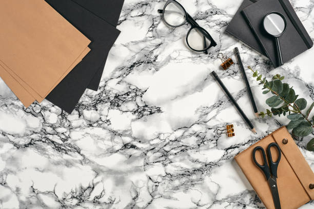 istock Top view in focus with different office equipment, supplies, stationery. Marble table with copy space. Education, workplace background. Close-up 1179806280