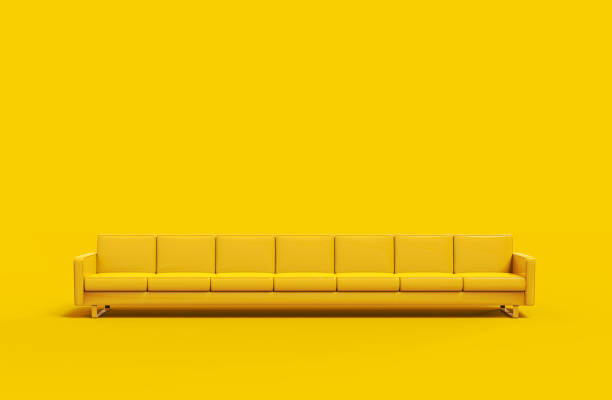 istock Extremely long yellow leather sofa isolated on yellow background. 3d rendering 1179806355
