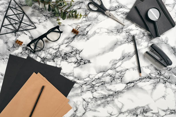 istock Top view in focus with different office equipment, supplies, stationery. Marble table with copy space. Education, workplace background. Close-up 1179806533