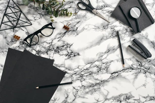 istock Top view in focus with different office equipment, supplies, stationery. Marble table with copy space. Education, workplace background. Close-up 1179806628