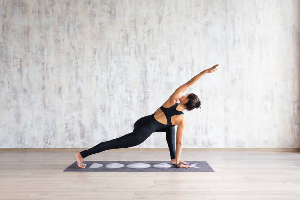 istock Yoga instructor doing parivritta parsvakonasana 1179806637