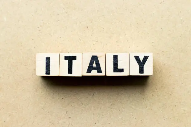 Photo of Letter block in word italy on wood background