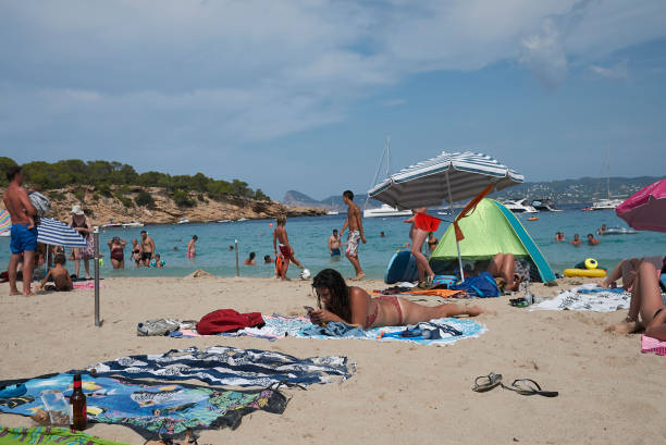 Ibiza, Spain - August 29, 2019  : Tourists sunbathing at CBbc beach club