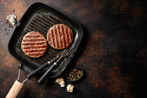 Grilled burger meat on board stock photo