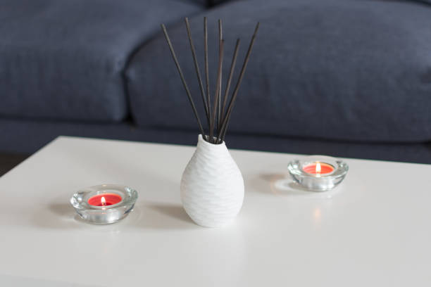 istock Room air refreshers and candles on table on home interior background. 1179811780